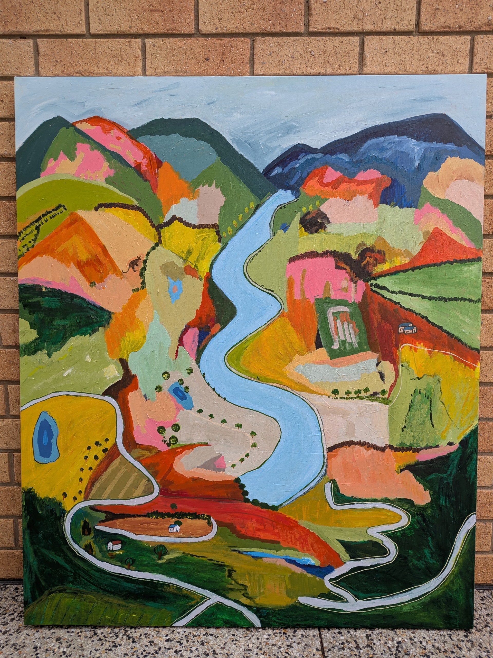 Colorful abstract painting of a landscape with a river By Alpana Rai